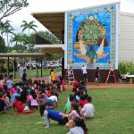 Kipapa students enjoy their new mural.  Most joyful for them is that they helped to build it, using over 15,000 pieces of smalti to create the border.  